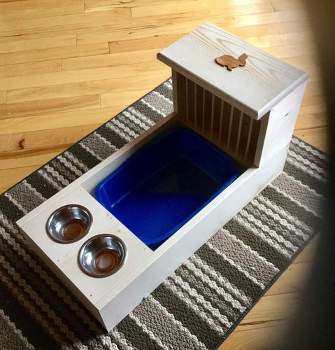 Rabbit hay feeder with dowels, attached litter tray, and attached bowl holder with two .5 pint bowls